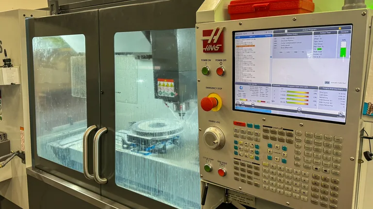 CNC turning in process for precision shafts and threaded components.