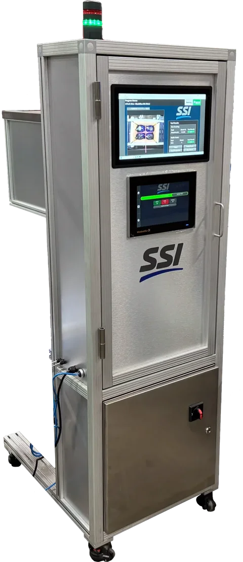 SSI Vision Tower inspection station installed beside a production conveyor.